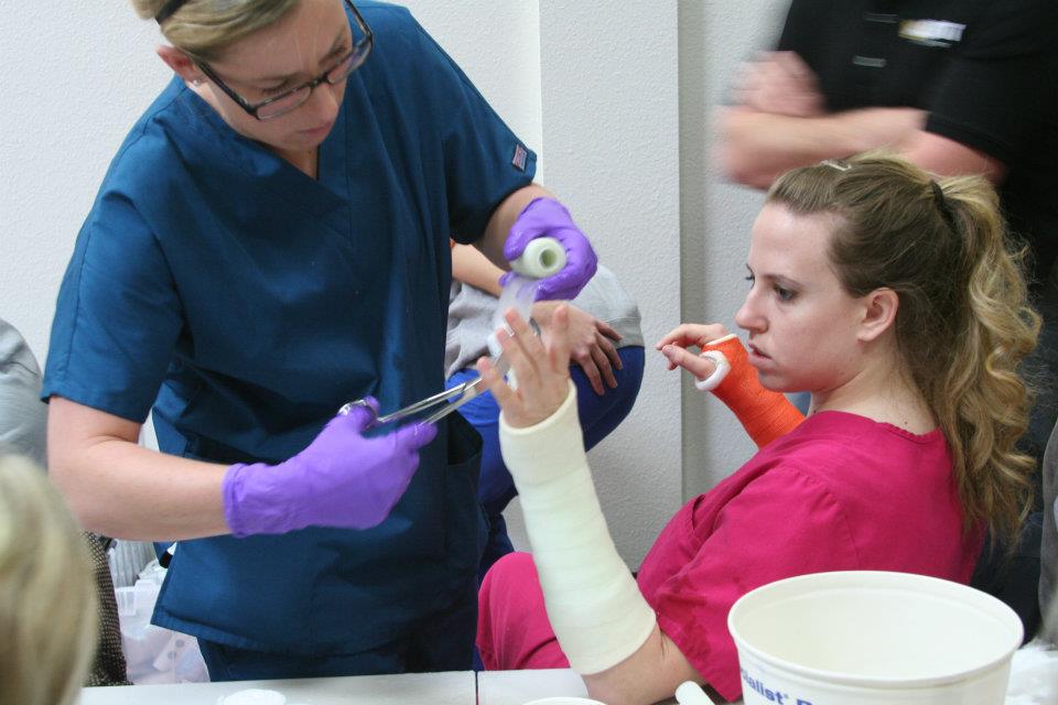 photo of woman applying short arm cast